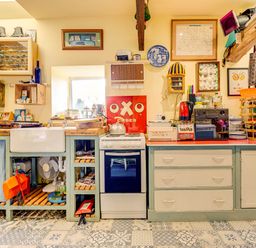 A kitchen with a sink and stove at Family Country Cottage with a private Valley View