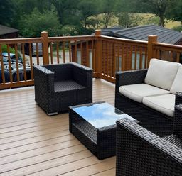 An outdoor area with wicker furniture and a table at 2 Bed Lodge-Sleeps 4-stunning views -Pet Friendly, Troutbeck