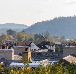 A view of rooftops and mountains at Luxury 2 Bed Room Lake View Apt Bowness Parking Bowness-On-Windermere