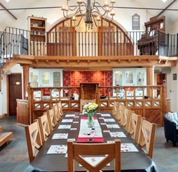 A dining room with a large table and chairs at Kaber Chapel near Kirby Stephen