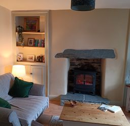 A living room with a sofa and fireplace at Bobbin Nook in Staveley