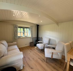 A living room with a sofa and armchairs at The Orchard in Ringstead