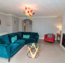 A living room with a sofa and coffee table at The Hideaway in Whitby