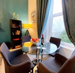 A dining room with a table and chairs at 2A Redcliffe Torquay