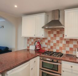 A kitchen with a gas stove and oven at 6 Dartmouth House in Dartmouth