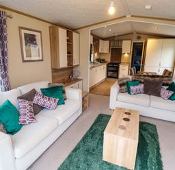 A living room with sofas and a coffee table at 108 Fox Burrow Hang in Great Yarmouth