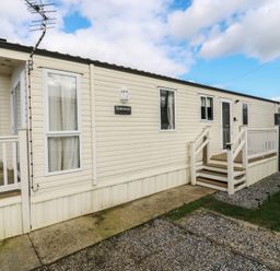 A caravan exterior with steps and railing at 2 bed Caravan in Stowmarket