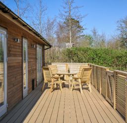 A deck area with a table and chairs at 4 Southern Place in Dobwalls