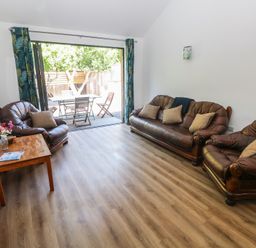A living room with sofas and a coffee table at Brookview Kingfisher in Haverfordwest