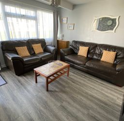 A living room with sofas and a coffee table at Chalet 57, California, Norfolk