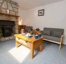 A living room with a sofa and coffee table at NO 10 Fortuneswell