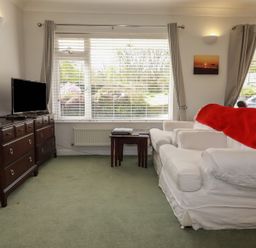A living room with a sofa and television at Tregoning annex Lerryn near Lostwithiel