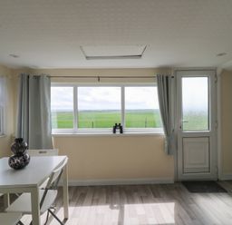 A dining room with a table and chairs at Watersmeet - 85 @ Park Avenue Holiday Village Leysdown-On-Sea, Kent