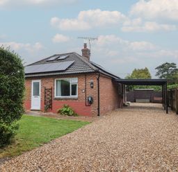 A house with a garden and pathway at 2 North Road in Maiden Newton, Dorset
