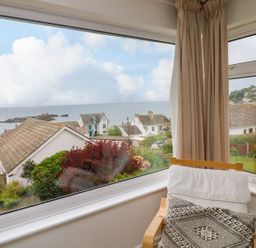 A room with a view of the sea and houses at Wootton Gray in Penzance