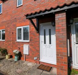 An entrance with a front door and plants at The Gower Gateway in Gowerton near Swansea