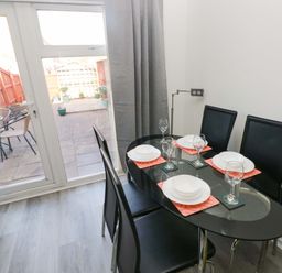 A dining room with a table and chairs at The Gower Gateway in Gowerton near Swansea