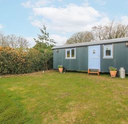 An outdoor shed with greenery at Skye in Clee Hill