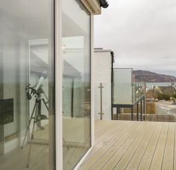A balcony with a telescope and sea view at 2 Ard an Chuain Dunfanaghy