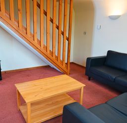 A living room with a sofa and coffee table at Bracken Lodge Finlakes Holiday Park near Chudleigh
