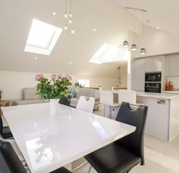 A dining area with a table and chairs at Meadow Retreat in Bodmin