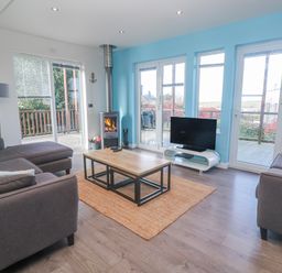 A living room with a coffee table and TV at Warleggan Redruth