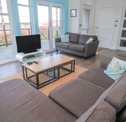 A living room with a sofa and television at Warleggan in Redruth