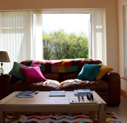 A living room with a sofa and coffee table at Welcome to the wild Atlantic way in Mulroy Bay