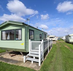 A caravan with steps and a pathway at The Seafront Cosy Caravan Ingoldmells