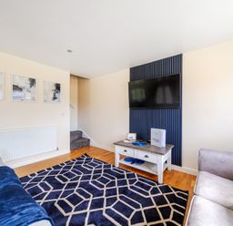 A living room with a sofa and television at Lodge 4 Near Brigg