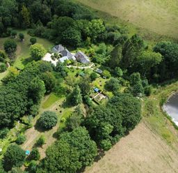 An overview of a property with a house and garden at The Bothy at Lewis Cottage in Spreyton