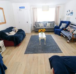 A living room with sofas and a coffee table at 3 Edward Street in Tenby