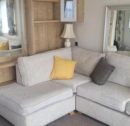 A living room with a grey sofa and lamp at Beachside Lodge - Sleeps 6 - Pets ok - Parking in Heysham
