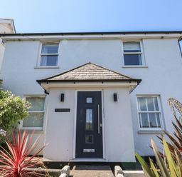 A house with a front door and windows at Lorrell in Salcombe