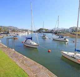 A marina with boats in the water at 10 Oakley Wharf Porthmadog