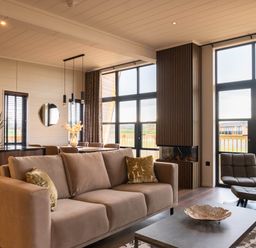 A living room with a sofa and coffee table at Exclusive Tempest Spa in Grimsby