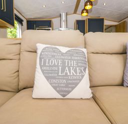 A living room with a cushion that says I Love The Lakes at 51 Calgarth Park in Troutbeck