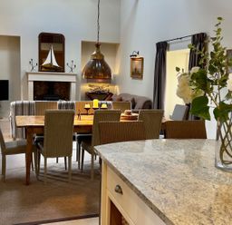 A dining room with a table and chairs at The Chimney in Bamburgh