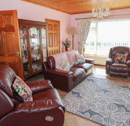 A living room with a sofa and armchairs at Marie's Country Home in Ardee, County Louth