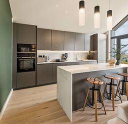 A kitchen with cabinets and a countertop at tbc in St. Ives