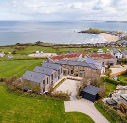 An aerial view of a house near the sea at tbc St. Ives