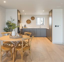 A dining room with a table and chairs at The Old Barn in St. Ives