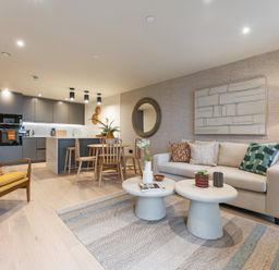 A living room with furniture and kitchen area at Hidden 19- Coastal Hot Tub St Ives