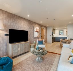 A living room with a sofa and television at tbc in St. Ives
