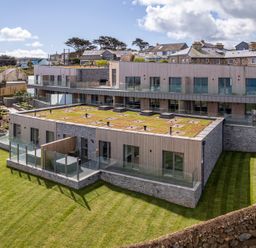 A modern building with grass terrace at tbc in St. Ives