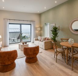 A living room with seating and dining area at tbc in St. Ives