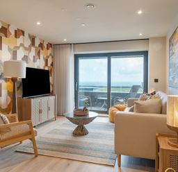 A living room with a television and sofa at tbc in St. Ives