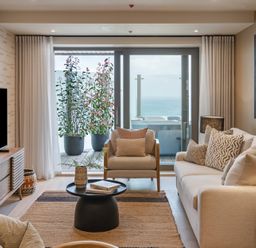 A living room with a sofa and television at tbc in St. Ives