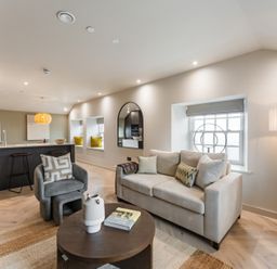 A living room with a couch and coffee table at tbc in St. Ives