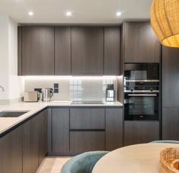 A kitchen with cabinets and appliances at tbc in St. Ives